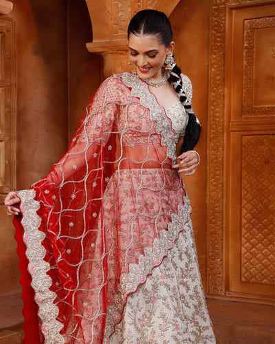 Pearl Ivory Lehenga Set With Unstitched Blouse Fabric And Contrast Red Dupatta