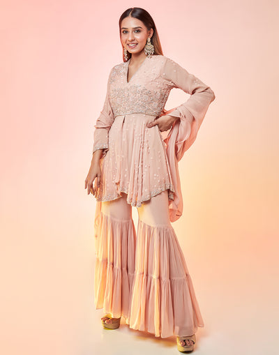Powder Peach Asymmetrical Peplum Gharara Suit Set With Hand Embroidery